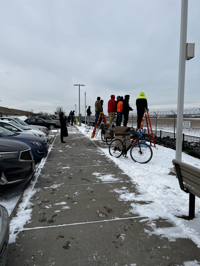 Spotters lined up at the Minneapolis (MSP) spotting area waiting for the first visit of a Delta aircraft painted in a special "Team USA" livery for the 2022 Winter Olympics.